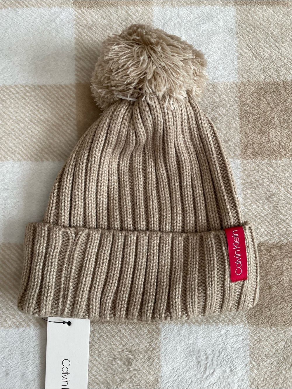NWT Calvin Klein Womenβs Beige Pom Pom Beanie